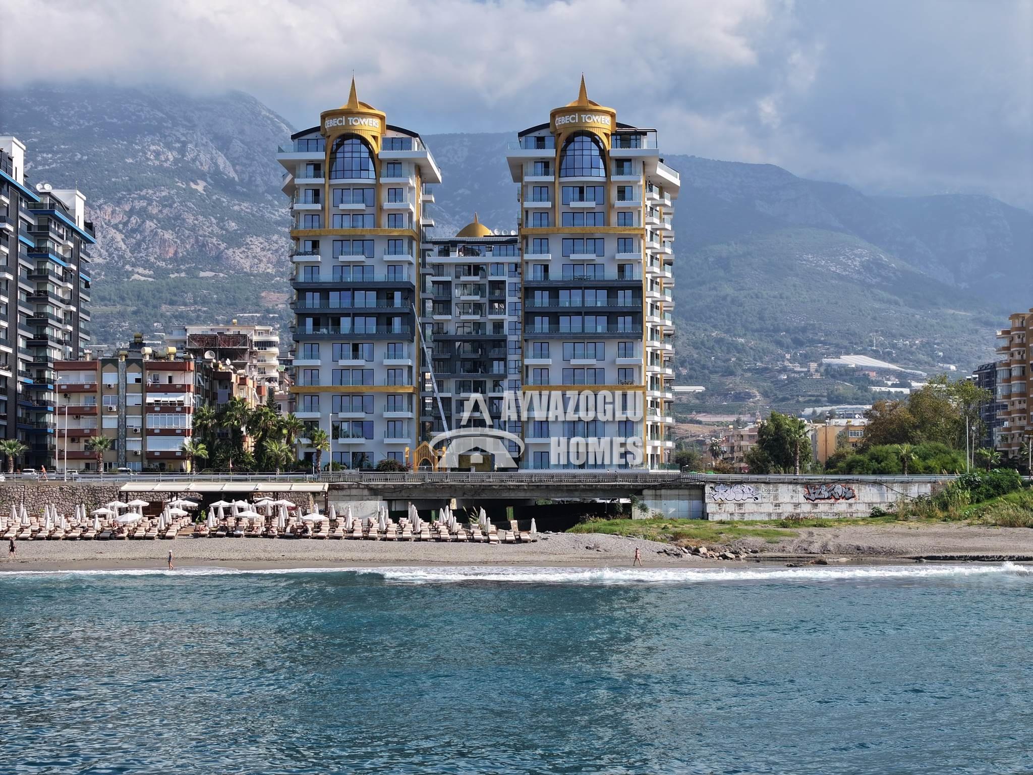 4985 Апартаменты 1+1 на первой линии моря с собственным пляжем в Махмутларе