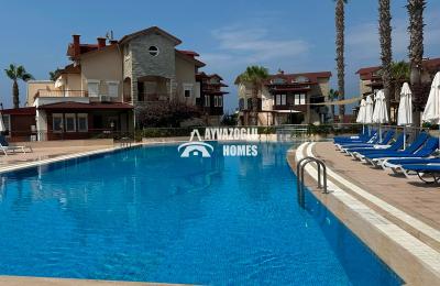 ID 5312 Located in the Türkler area, **just 200 meters from the sea**, this spacious **2+1 apartment**